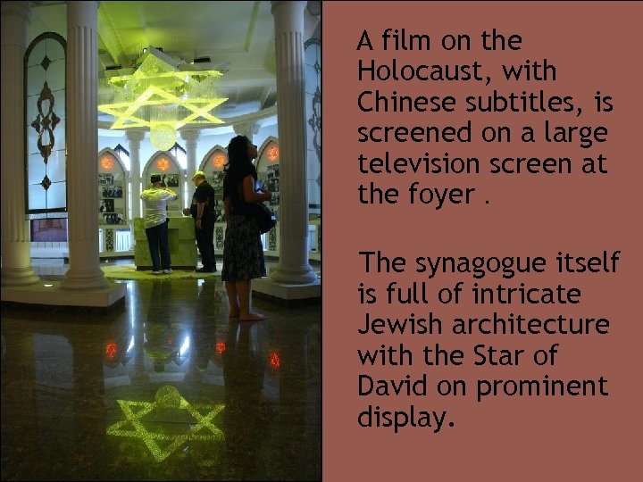 A film on the Holocaust, with Chinese subtitles, is screened on a large television