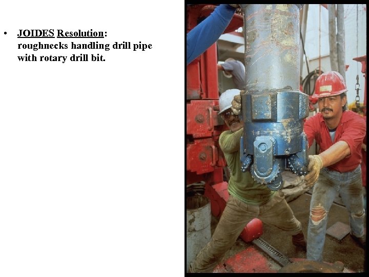  • JOIDES Resolution: roughnecks handling drill pipe with rotary drill bit. 