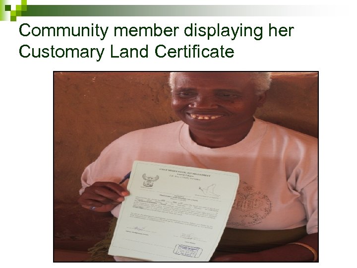 Community member displaying her Customary Land Certificate 