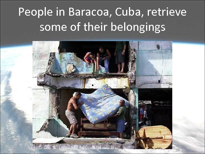 People in Baracoa, Cuba, retrieve some of their belongings 