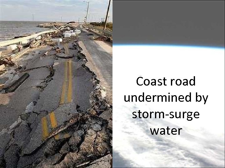 Coast road undermined by storm-surge water 