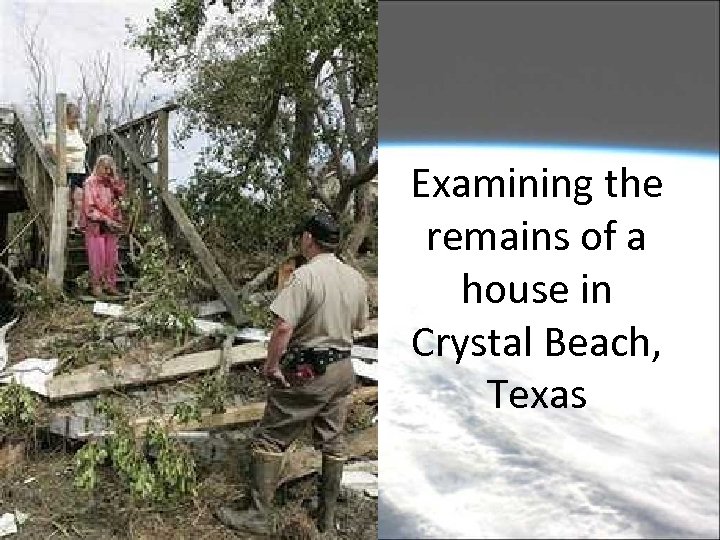 Examining the remains of a house in Crystal Beach, Texas 