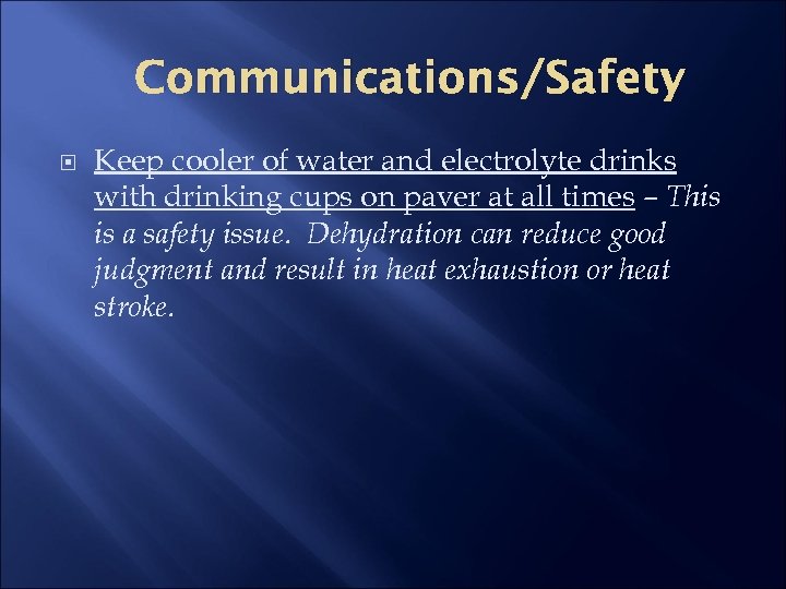 Communications/Safety Keep cooler of water and electrolyte drinks with drinking cups on paver at