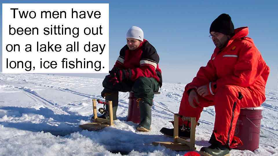 Two men have been sitting out on a lake all day long, ice fishing.