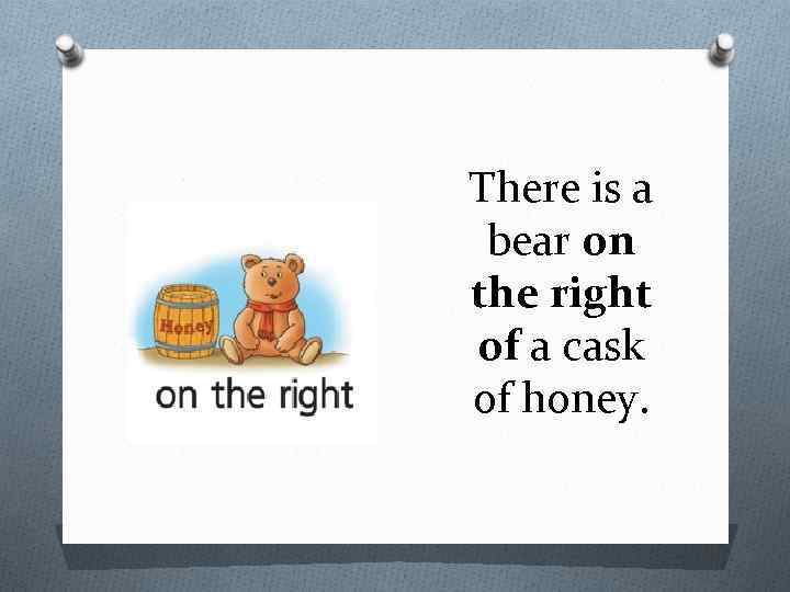 There is a bear on the right of a cask of honey. 