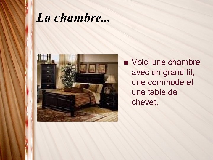 La chambre. . . n Voici une chambre avec un grand lit, une commode