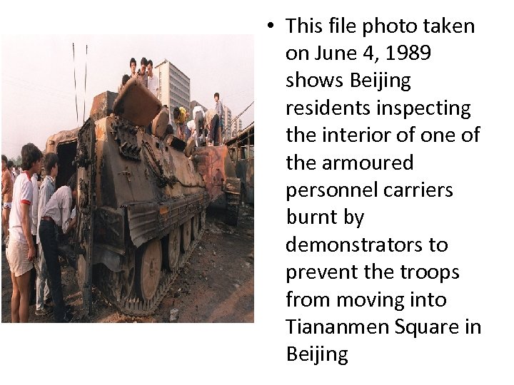  • This file photo taken on June 4, 1989 shows Beijing residents inspecting