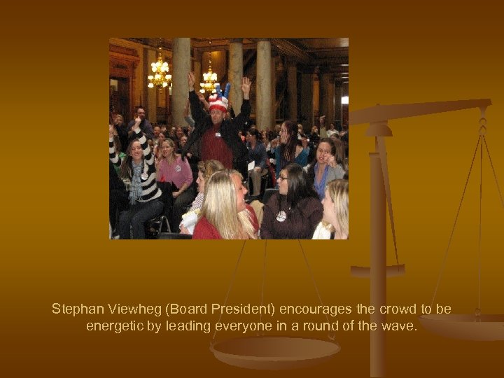 Stephan Viewheg (Board President) encourages the crowd to be energetic by leading everyone in