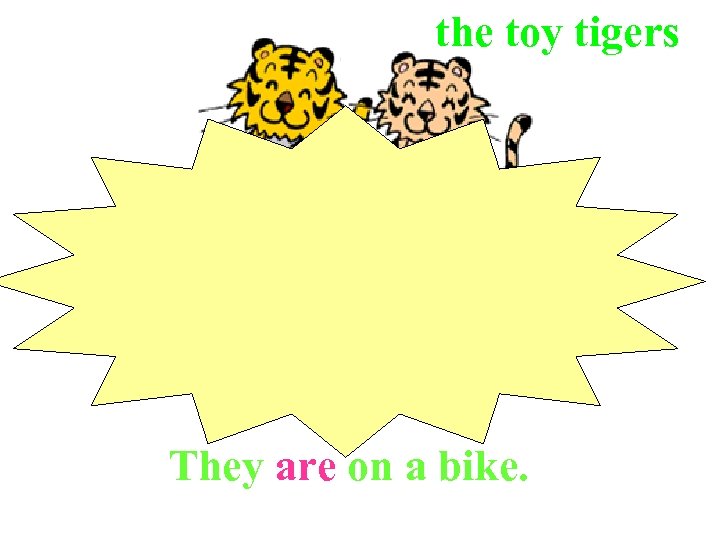 the toy tigers They are on a bike. 