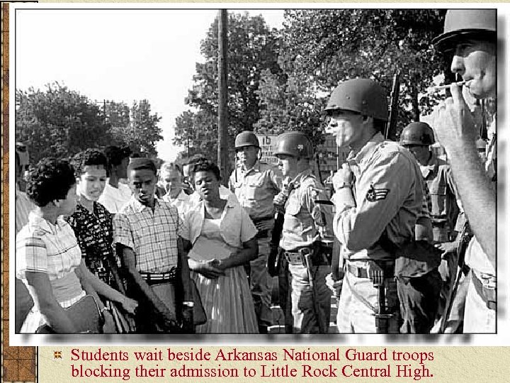 Students wait beside Arkansas National Guard troops blocking their admission to Little Rock Central