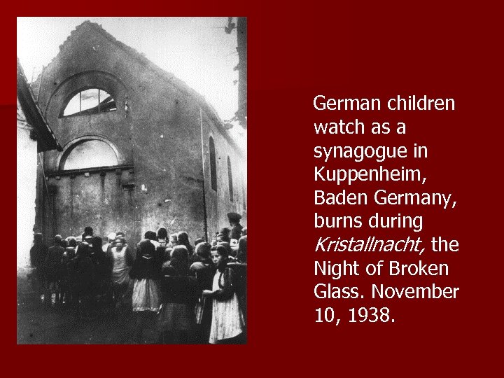  German children watch as a synagogue in Kuppenheim, Baden Germany, burns during Kristallnacht,