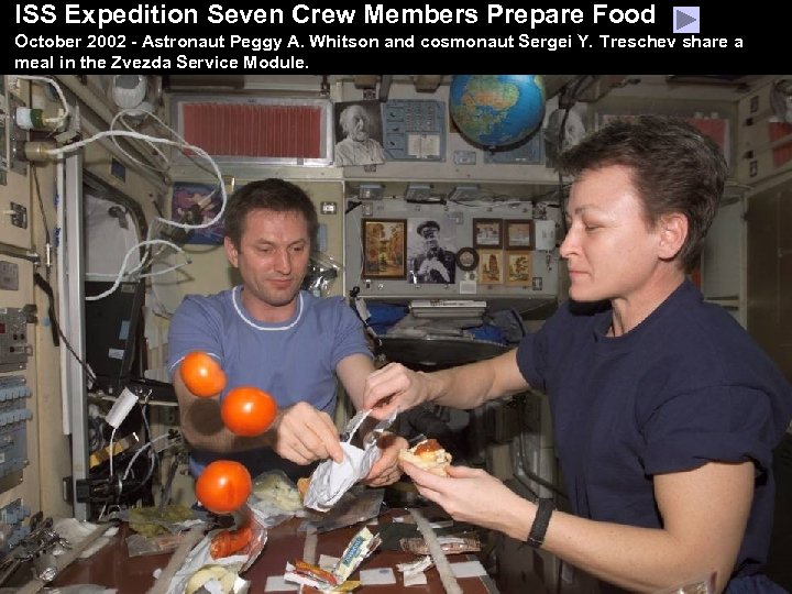 ISS Expedition Seven Crew Members Prepare Food October 2002 - Astronaut Peggy A. Whitson