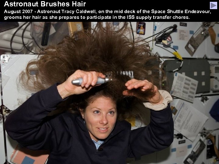 Astronaut Brushes Hair August 2007 - Astronaut Tracy Caldwell, on the mid deck of