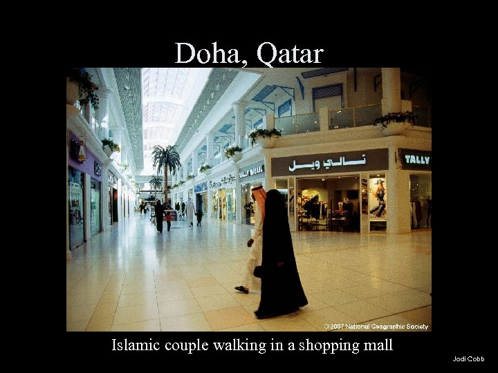 Doha, Qatar Islamic couple walking in a shopping mall Jodi Cobb 