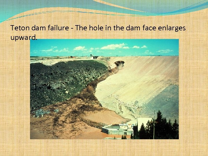 Teton dam failure - The hole in the dam face enlarges upward. 