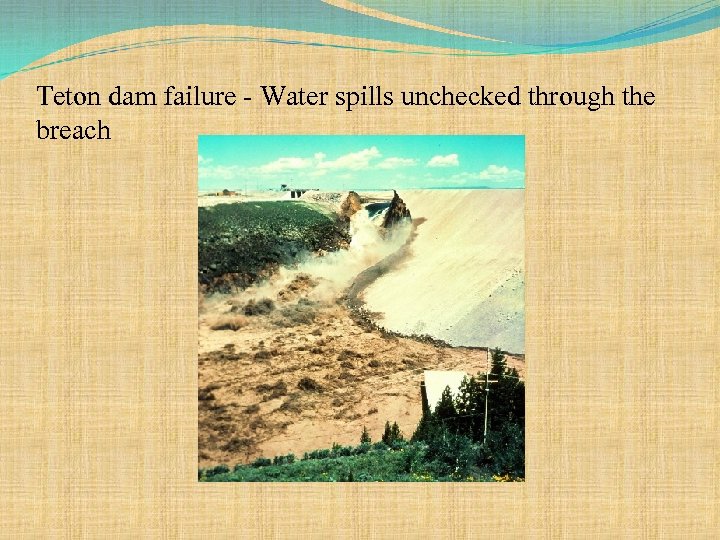 Teton dam failure - Water spills unchecked through the breach 