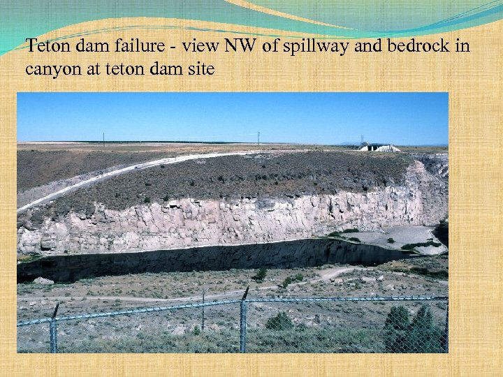 Teton dam failure - view NW of spillway and bedrock in canyon at teton