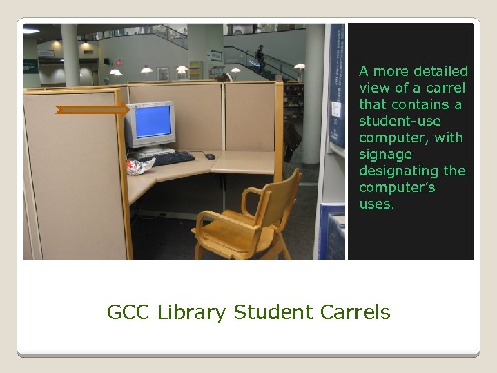 A more detailed view of a carrel that contains a student-use computer, with signage