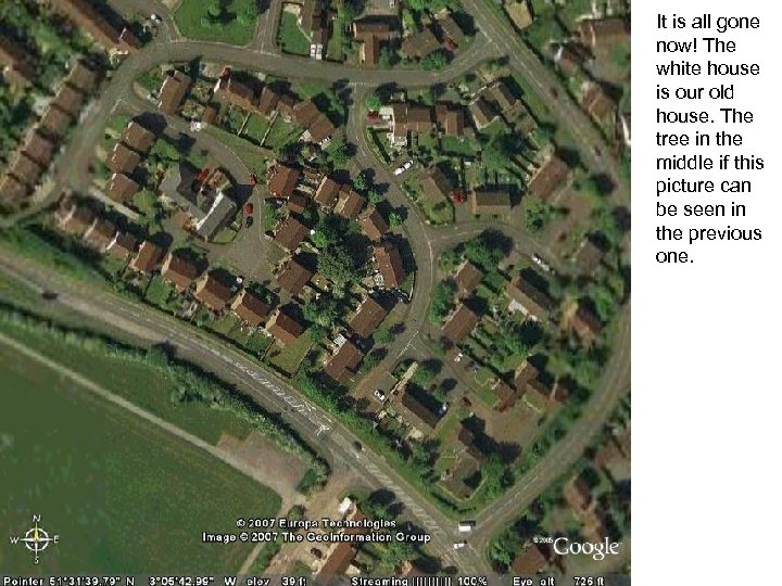 It is all gone now! The white house is our old house. The tree