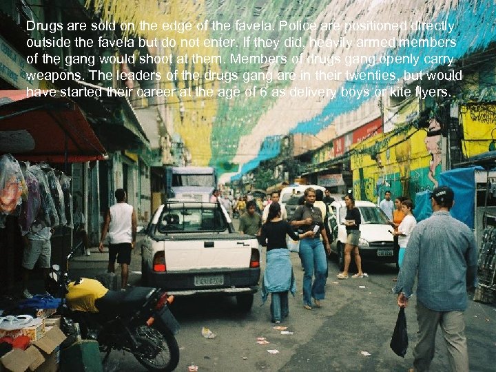 Drugs are sold on the edge of the favela. Police are positioned directly outside