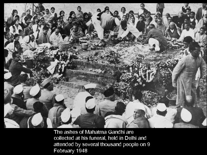 The ashes of Mahatma Gandhi are collected at his funeral, held in Delhi and