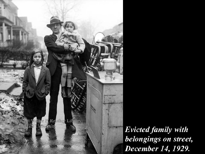 Evicted family with belongings on street, December 14, 1929. 