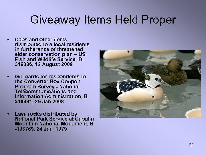 Giveaway Items Held Proper • Caps and other items distributed to a local residents