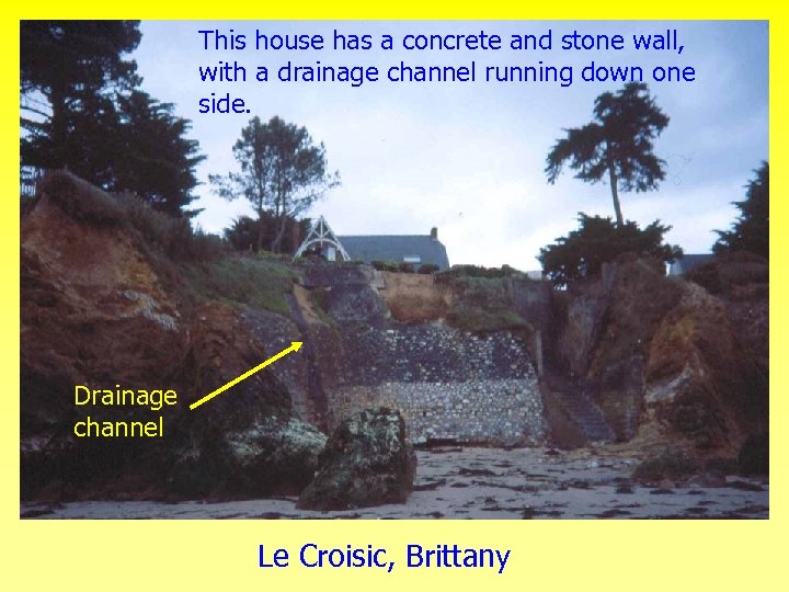 This house has a concrete and stone wall, Le drainage channel with a. Croisic,