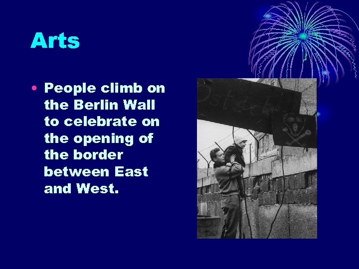 Arts • People climb on the Berlin Wall to celebrate on the opening of