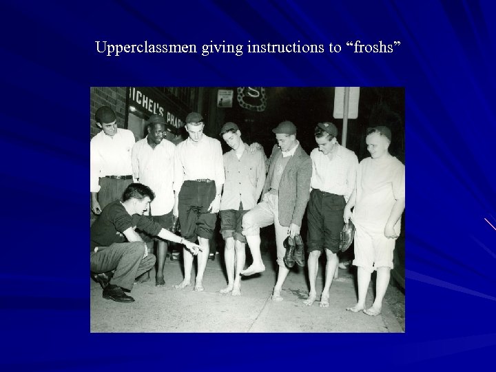 Upperclassmen giving instructions to “froshs” 