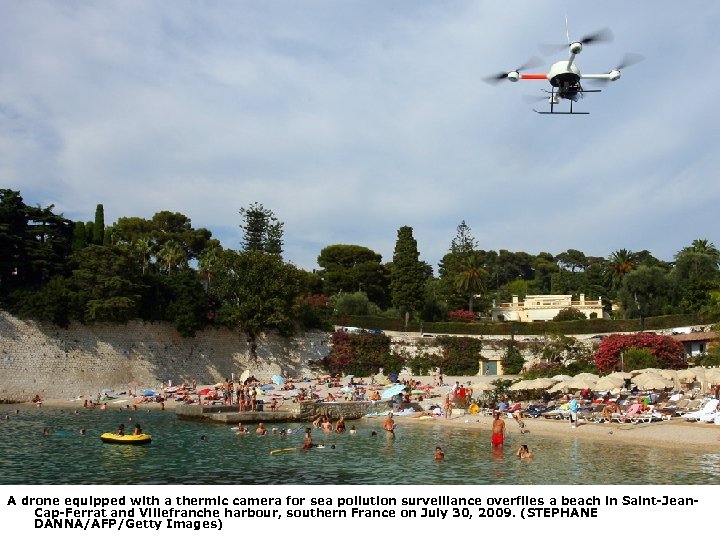 A drone equipped with a thermic camera for sea pollution surveillance overflies a beach