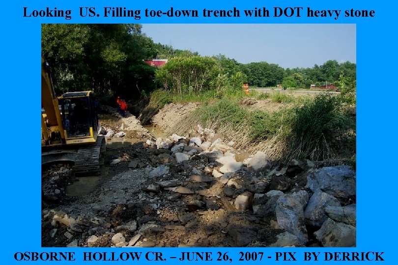 Looking US. Filling toe-down trench with DOT heavy stone OSBORNE HOLLOW CR. – JUNE