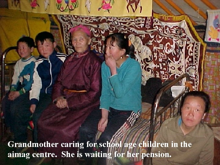 Grandmother caring for school age children in the aimag centre. She is waiting for