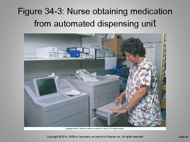 Figure 34 -3: Nurse obtaining medication from automated dispensing unit Copyright © 2014, 2009