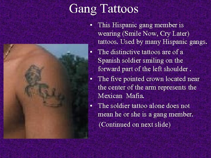 Gang Tattoos • This Hispanic gang member is wearing (Smile Now, Cry Later) tattoos.
