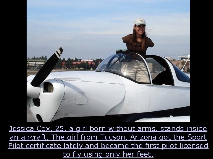 Jessica Cox, 25, a girl born without arms, stands inside an aircraft. The girl