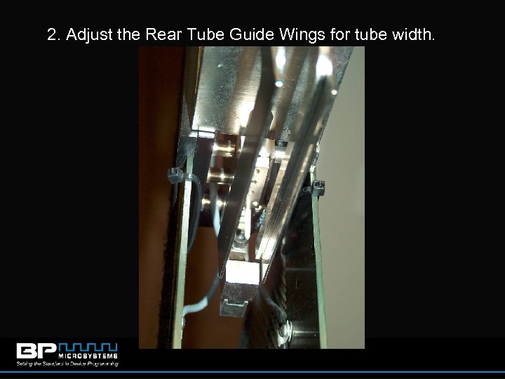 2. Adjust the Rear Tube Guide Wings for tube width. 