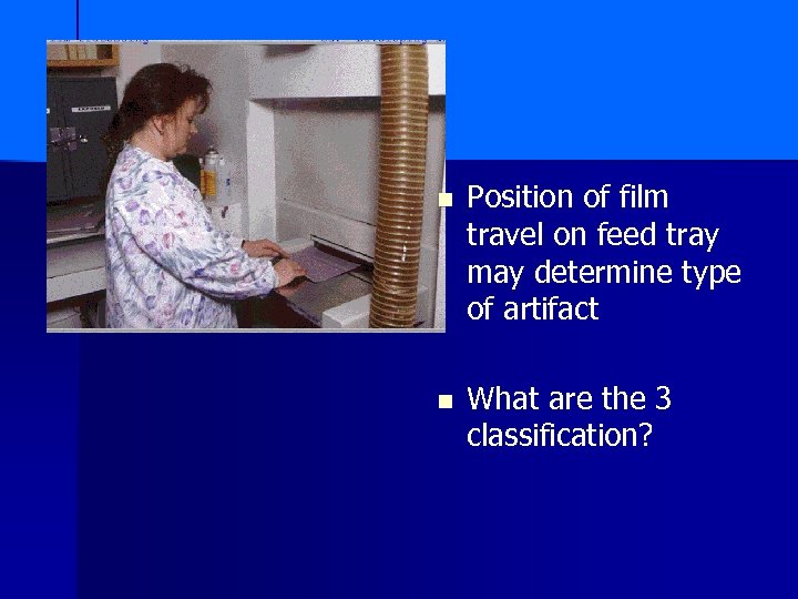 n Position of film travel on feed tray may determine type of artifact n