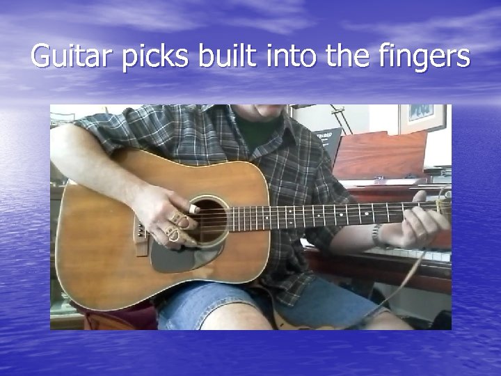 Guitar picks built into the fingers 