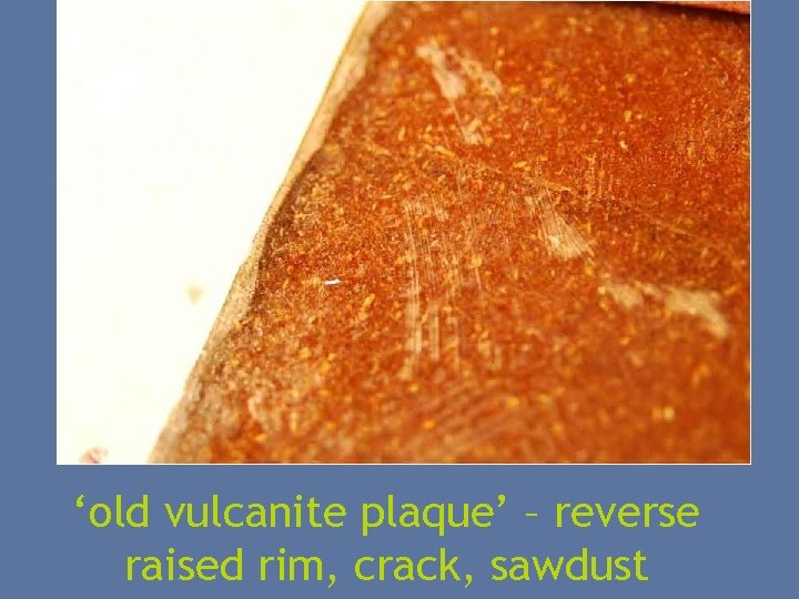 ‘old vulcanite plaque’ – reverse raised rim, crack, sawdust 