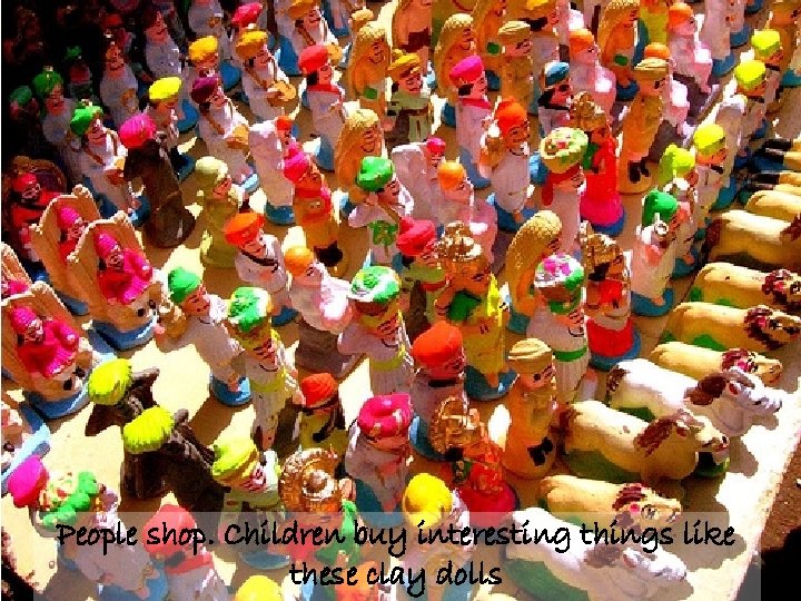 People shop. Children buy interesting things like these clay dolls 