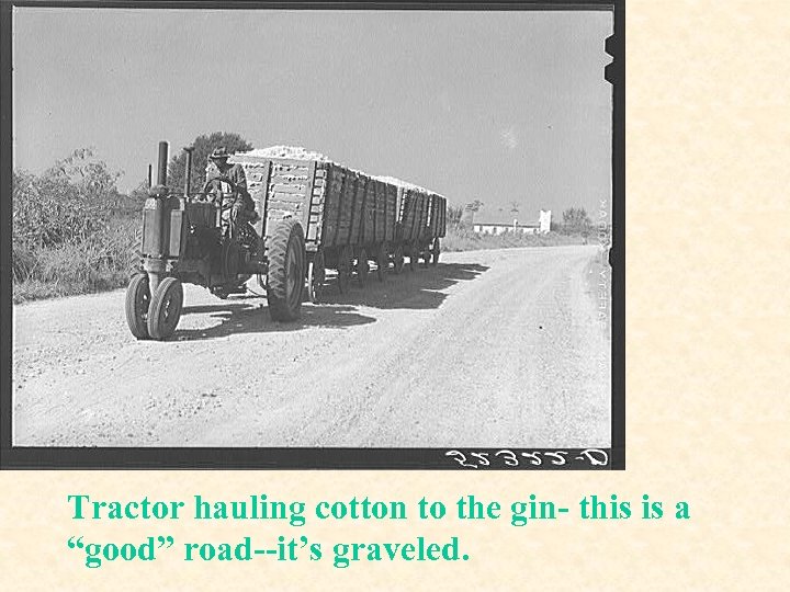 Tractor hauling cotton to the gin- this is a “good” road--it’s graveled. 