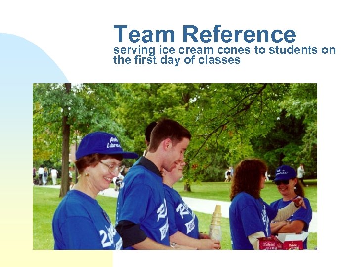Team cream cones to students on Reference serving ice the first day of classes