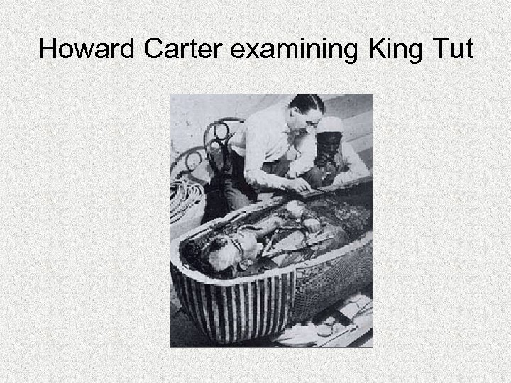 Howard Carter examining King Tut 