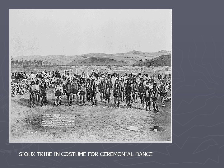SIOUX TRIBE IN COSTUME FOR CEREMONIAL DANCE 