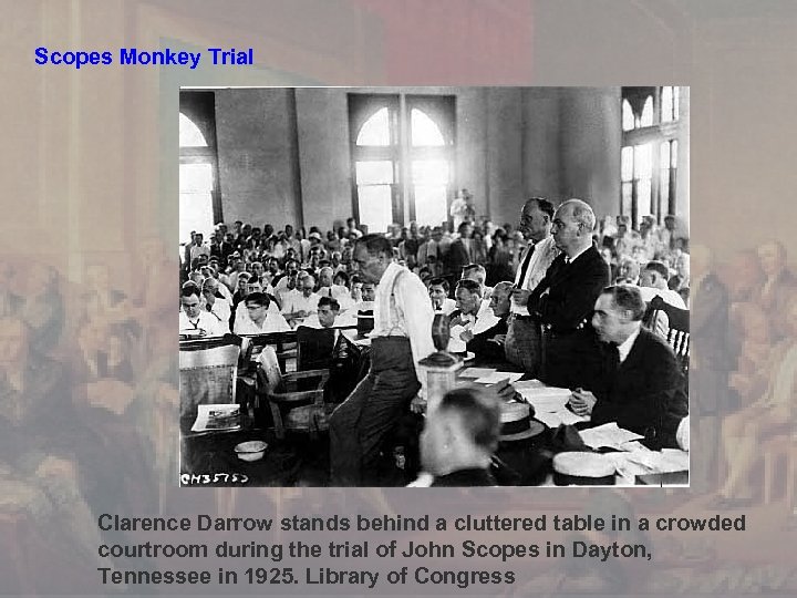 Scopes Monkey Trial Clarence Darrow stands behind a cluttered table in a crowded courtroom