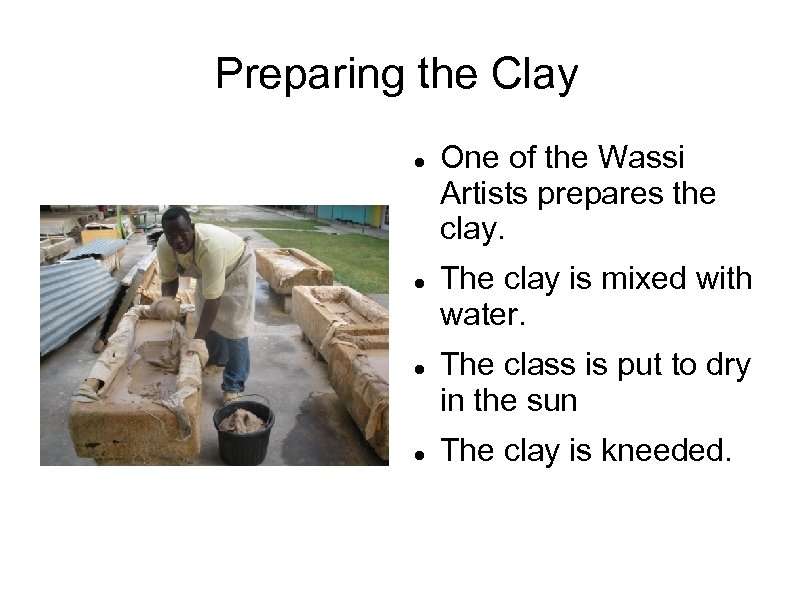 Preparing the Clay One of the Wassi Artists prepares the clay. The clay is