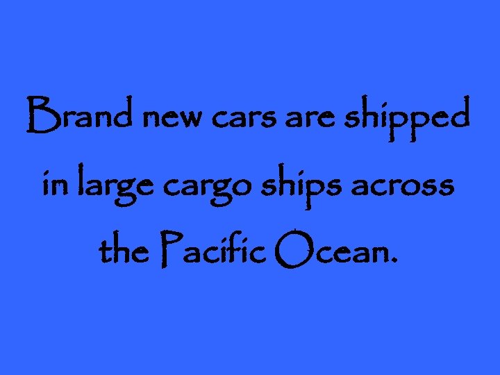 Brand new cars are shipped in large cargo ships across the Pacific Ocean. 