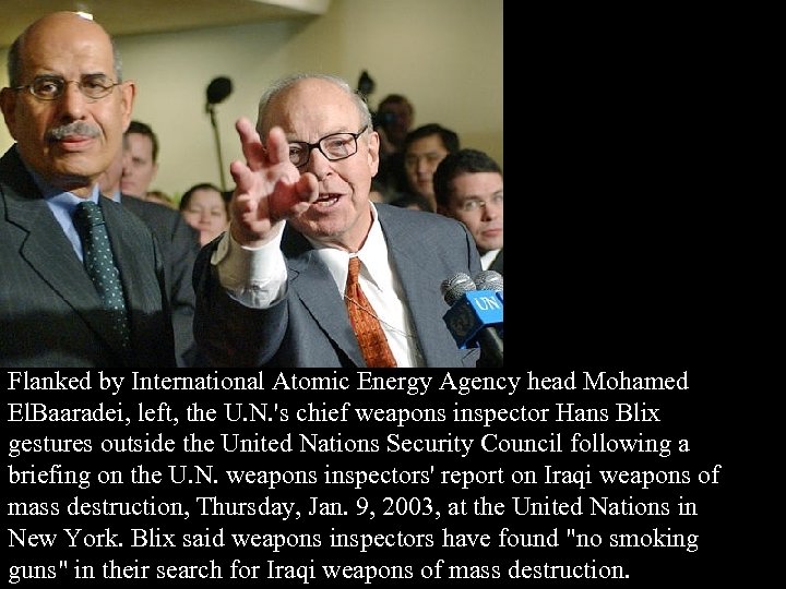Flanked by International Atomic Energy Agency head Mohamed El. Baaradei, left, the U. N.