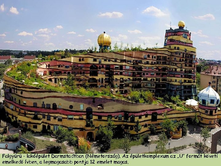 Falgyűrű - lakóépület Darmstadtban (Németország). Az épületkomplexum az „U” formát követi emelkedő ívben, a